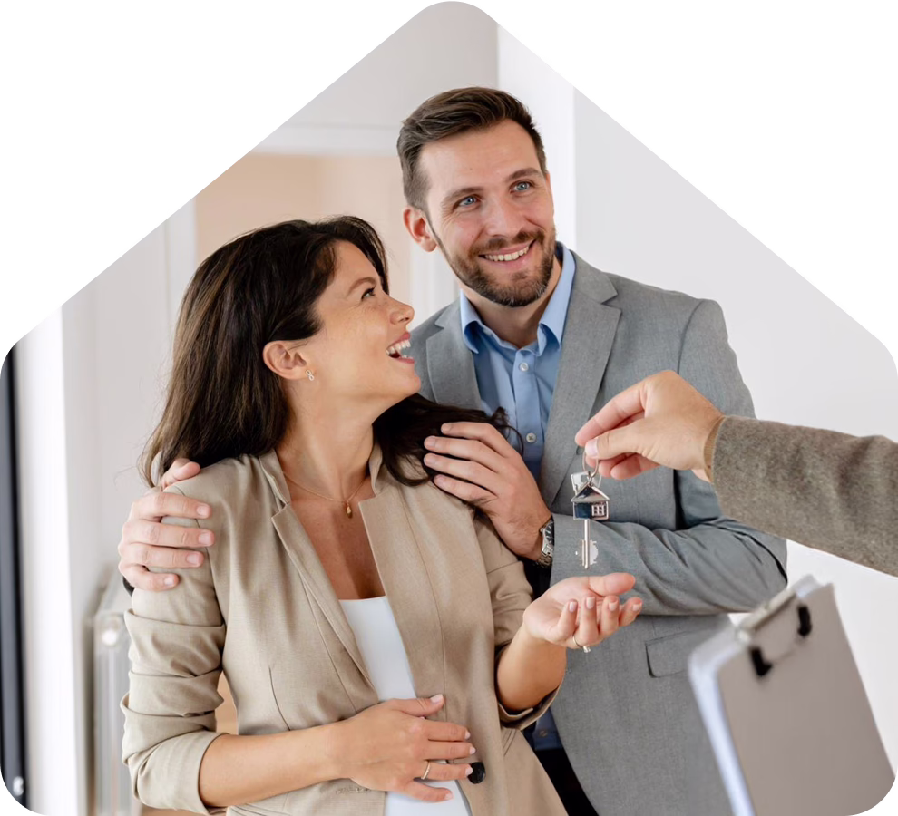 The couple beams with joy as they hold the keys to their new house, marking a significant milestone in their lives.